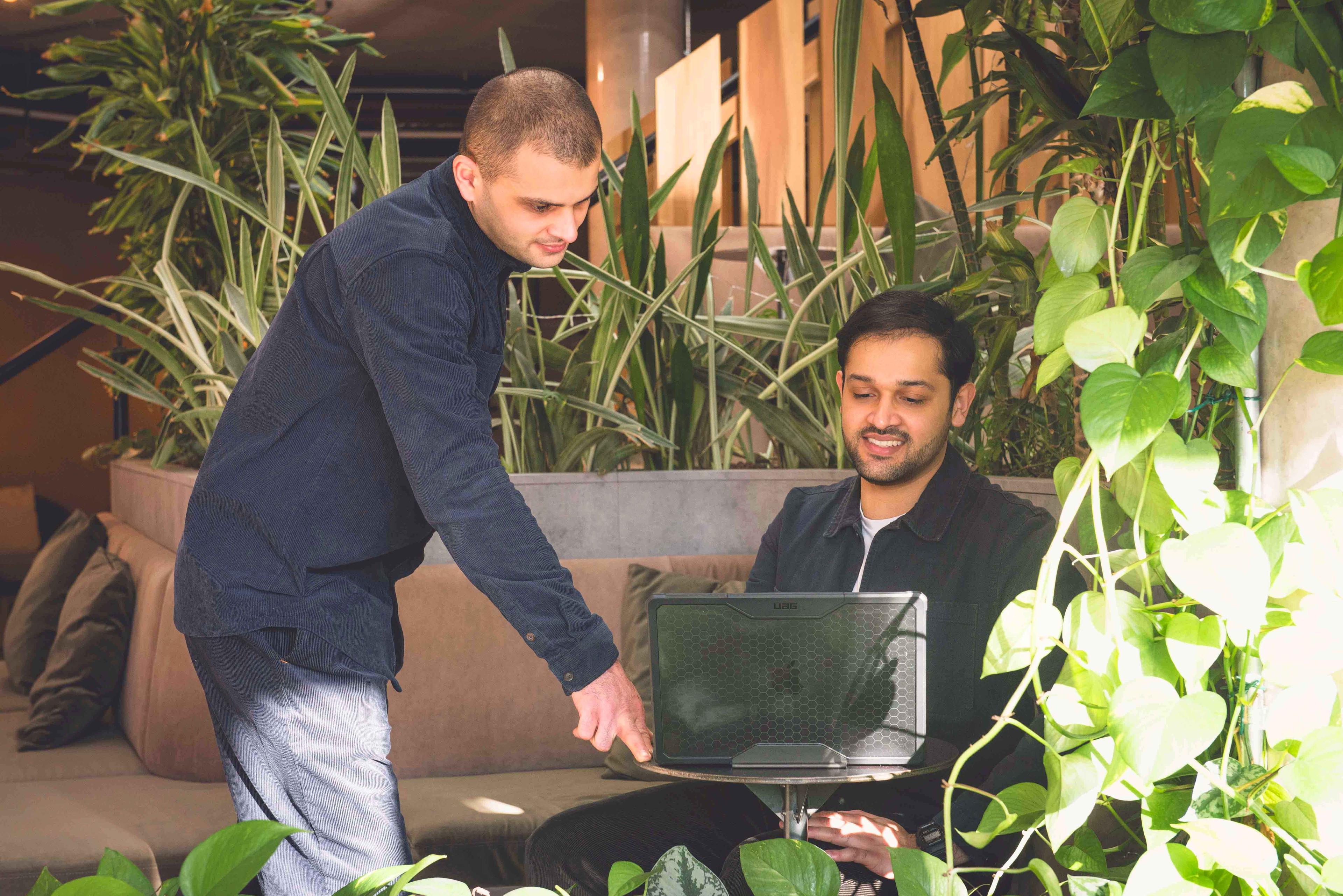 Halo team collaborating at a laptop